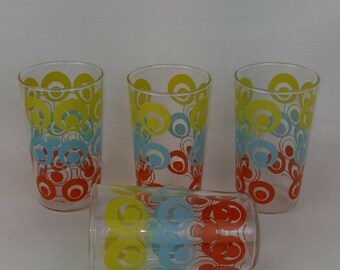 White and Green Daisy pattern Swanky Swigs Juice Cups with a Red 3 12 tall.