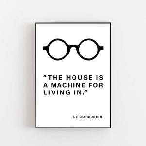May include: Black and white printable art print with a quote by Le Corbusier: "The house is a machine for living in."