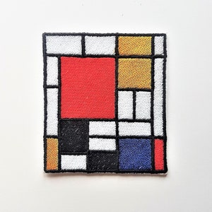 May include: A colourful embroidered patch with a geometric design featuring red, yellow, blue, black and white squares.