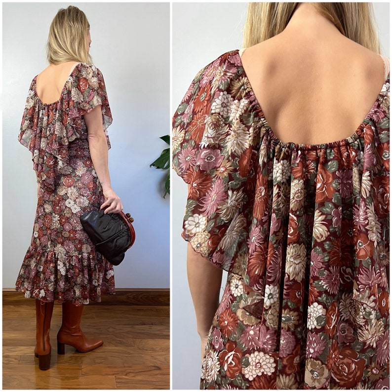 May include: A brown and pink floral print midi dress with a ruffled neckline and short sleeves. The dress has a gathered waist and a ruffled hem.