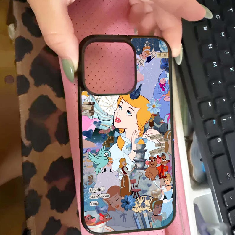 May include: Black phone case featuring a collage of Cinderella-themed illustrations. The design includes Cinderella, birds, and other characters in a blue, pink, and white color scheme. The text "I told the Stars about You" is visible.