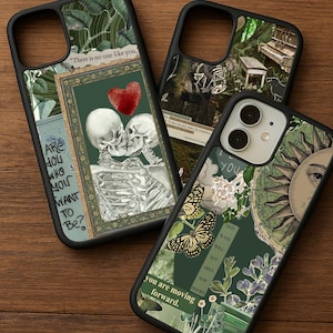 May include: Three black phone cases with unique designs. One features skeletons kissing with a red heart, another has a piano in a forest, and the third showcases butterflies, a sun, and text that reads "you are moving forward."