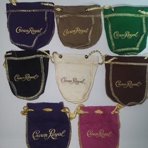 May include: Set of eight small drawstring bags in various colors, each with the embroidered text "Crown Royal" in gold.