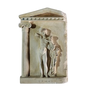 May include: A beige relief sculpture showing a classical scene with two figures, one holding the other. The sculpture is framed by a column and a triangular pediment. The figures are nude. The text "EPMHS" is at the bottom.