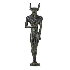 May include: A bronze statue of a humanoid figure with a bull's head and horns. The figure holds a double-bladed axe and stands on a square base. The statue is approximately 30 cm tall.