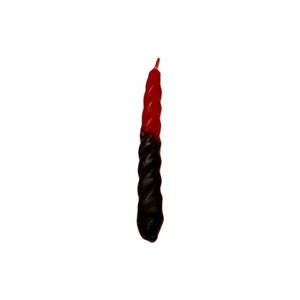May include: A single twisted taper candle, half red and half black, against a white background. The candle has a textured, rope-like appearance. The top is red, transitioning to black at the base.