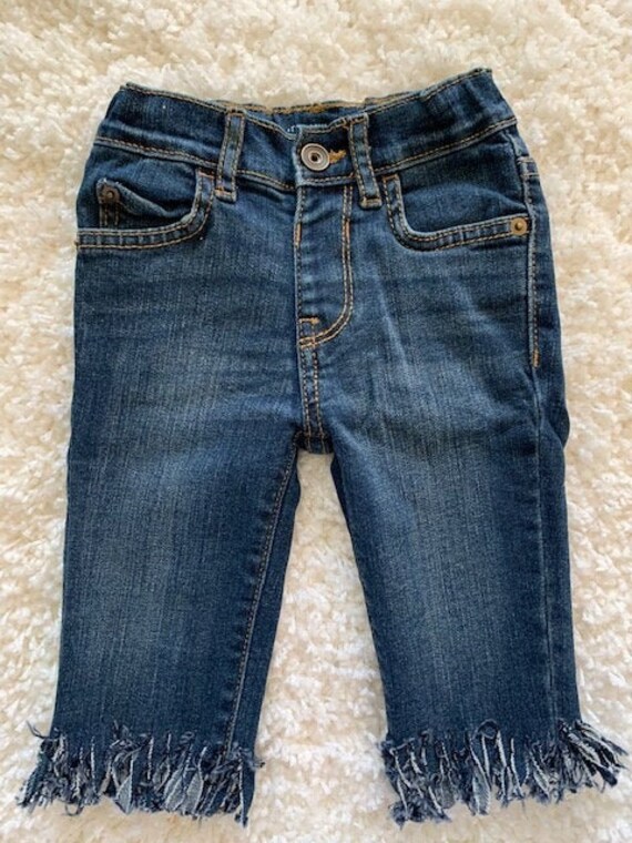 shredded bottom jeans