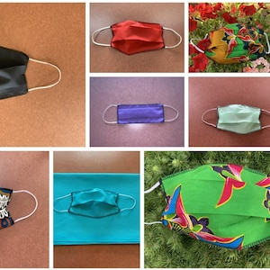 Può includere: Un collage di 10 diverse maschere in tessuto. Le maschere sono tutte realizzate con tessuti e motivi diversi, tra cui nero, rosso, viola, verde, blu e bianco. Alcune delle maschere hanno un motivo floreale, mentre altre hanno un motivo geometrico.