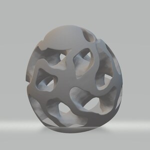 Puede incluir: Una escultura abstracta tridimensional de color gris con un dise&ntilde;o de rejilla. La escultura est&aacute; hecha de un material liso y s&oacute;lido y tiene una forma esf&eacute;rica.