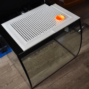 May include: A white ceramic mug with a black handle and the text "But First, Coffee" in a black, bold font. The mug is on a white surface.