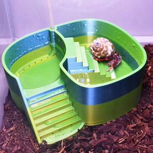 Piscina com borbulhador em formato de caranguejo-eremita. Seções separadas de água doce e salgada com borbulhador integrado. Banheira dupla em formato de caranguejo-eremita. Rampa de fácil acesso.