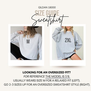 May include: Size guide for Gildan 18000 sweatshirts. Two models wearing the same sweatshirt in different sizes: a size M for a relaxed fit and a size 2XL for an oversized fit. The model is 5'8" tall.