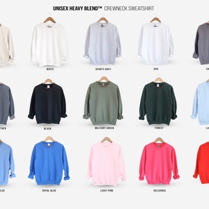 May include: A range of crewneck sweatshirts in a variety of colours, including sand, white, sports grey, ash, charcoal, dark grey heather, black, military green, forest, light blue, carolina blue, royal blue, light pink, and heliconia.