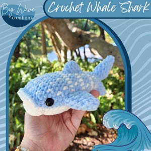 May include: A crocheted whale shark in light blue with white spots and a white belly. The plush toy has a black button eye. The image includes the text "Crochet Whale Shark" and "Big Wave creations".