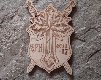 May include: A wooden shield with a cross and two swords, the text "EPH 6:11-17" is engraved on the shield.