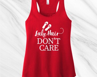 May include: Red tank top with a white graphic that says "Lake Hair Don't Care" with a pair of flip flops above the text.
