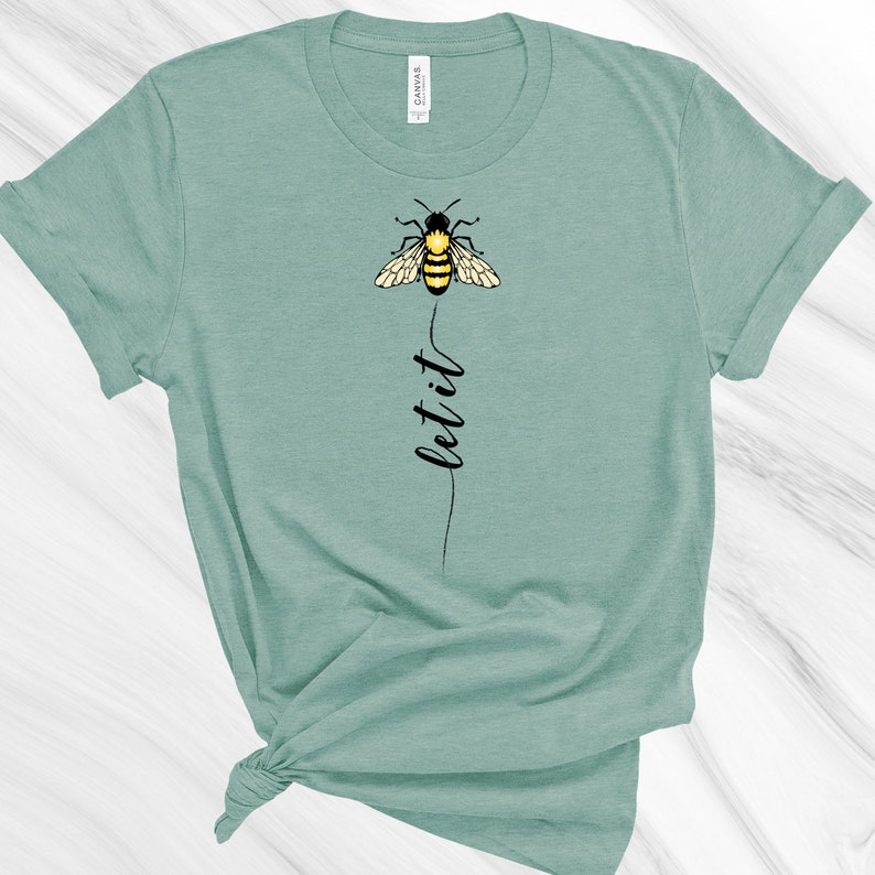 May include: A teal blue t-shirt with a black and yellow bee graphic and the text "let it" printed vertically below the bee.
