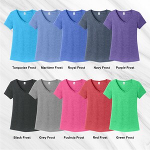 May include: Ten different colors of V-neck t-shirts, including turquoise, maritime, royal, navy, purple, black, grey, fuchsia, red, and green.