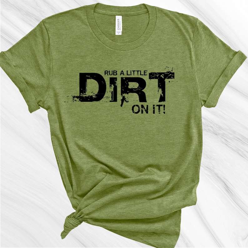 May include: A green t-shirt with the text "Rub a little dirt on it!" in black lettering.