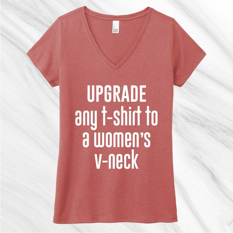 May include: A red v-neck t-shirt with the text "UPGRADE any t-shirt to a women's v-neck" printed in white.