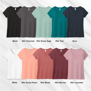 May include: Ten V-neck t-shirts in various colors, including black, charcoal, dusty sage, teal, navy, white, dusty peach, blush, maroon, and lavender.