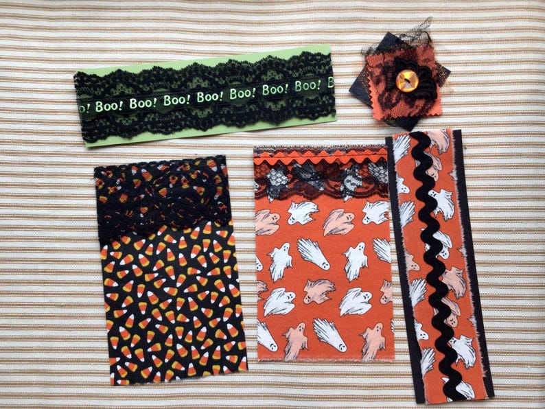 Samples of fabric flips and belly bands. You will receive one of each, plus a fabric cluster with a vintage button topper.