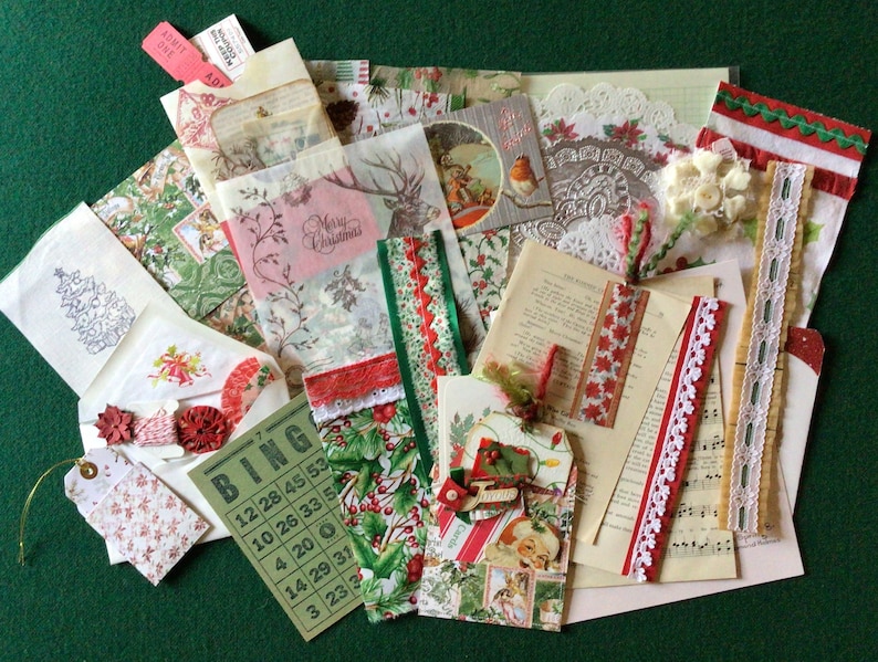 May include: A collection of vintage Christmas paper ephemera, including a bingo card, a tag, a lace doily, and various ribbons and trims. The papers are in shades of red, green, and white.