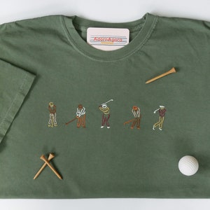 Golfers Swinging Golf Clubs Machine Embroidered T-Shirt