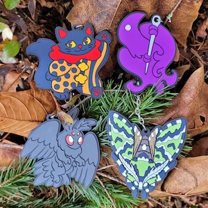 Keychain - Rubber Clown Cat Ghostlycorvid Mothman Moth