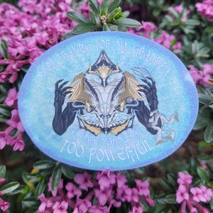 May include: A blue and white circular sticker with a graphic of a character from a video game. The text on the sticker reads "Stop praying for my grandpa you are making him too powerful."