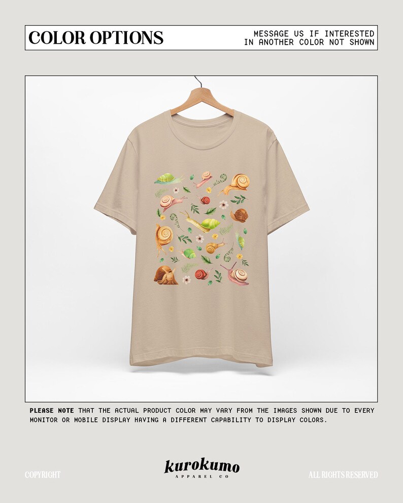 May include: A beige t-shirt with a print of snails, leaves, and flowers. The shirt has short sleeves and a crew neck.