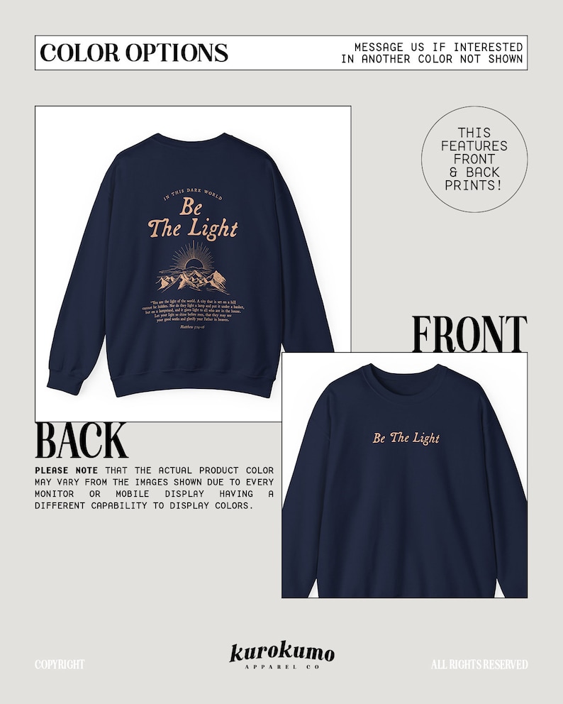 May include: Navy blue sweatshirt with a front and back print. The front print says "Be The Light" in a light peach color. The back print features a mountain scene with the text "In this dark world, Be The Light" and a bible verse.