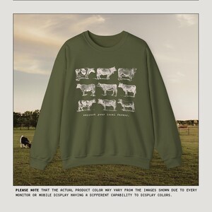 May include: A green sweatshirt with a white graphic of cows and the text "support your local farmer."