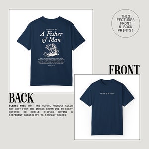 May include: A navy blue t-shirt with a white graphic print on the back that says "Jesus Made Me A Fisher of Man" and a white graphic print on the front that says "I Catch & He Cleans".