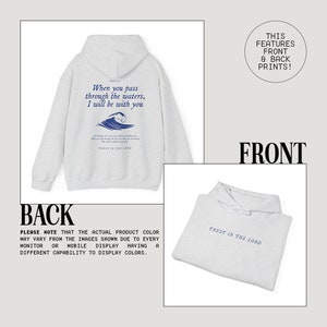 May include: A gray hooded sweatshirt with a blue wave graphic and the text "When you pass through the waters, I will be with you" and "Trust in the Lord" on the back. The front of the sweatshirt has the text "Trust in the Lord" printed on it.