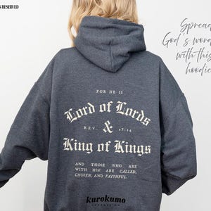 May include: Gray hooded sweatshirt with the text "FOR HE IS Lord of Lords REV & 17:14 King of Kings AND THOSE WHO ARE WITH HIM ARE CALLED, CHOSEN, AND FAITHFUL." printed on the back. The text is in a white, gothic font.