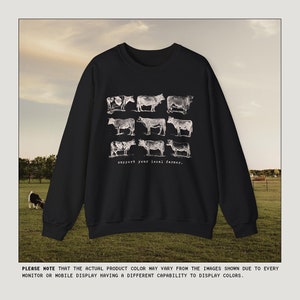 May include: Black sweatshirt with a white graphic of nine cows and the text "support your local farmer."