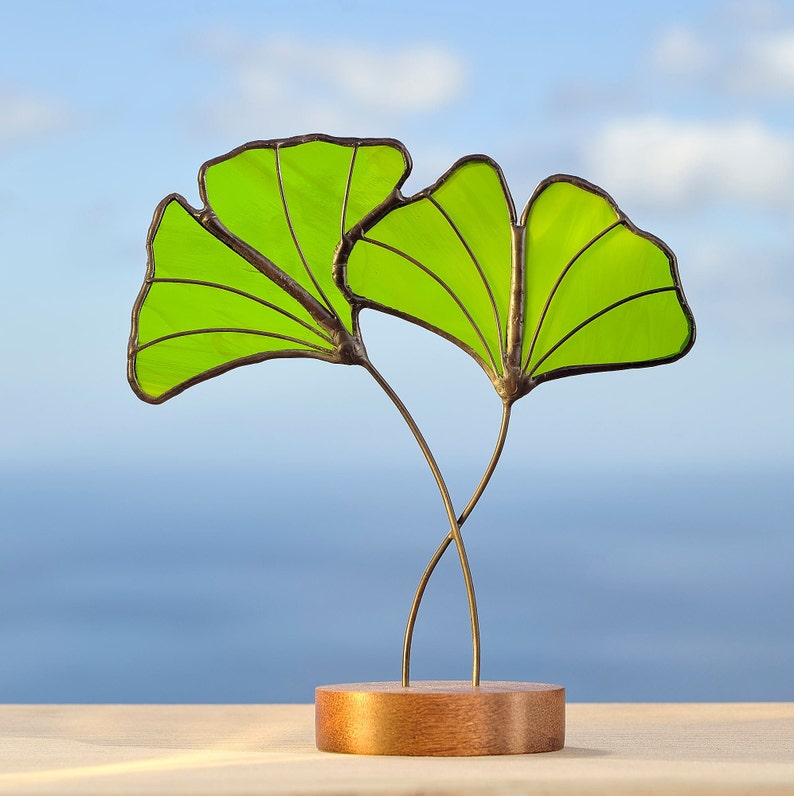 Read the full title Stained glass Ginkgo leaves on the wooden stand Stained glass suncatcher Window decoration Ginkgo leaf