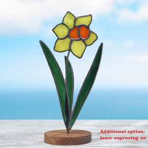Stained glass yellow daffodil on the wooden stand Stained glass  suncatcher Flower decoration.