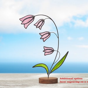 Stained glass Pinkbells on the wooden stand Stained glass  suncatcher