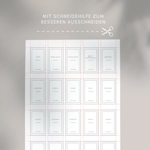 May include: A sheet of white spice labels with black text, including "Anis", "Barlauch", and "Basilikum". The labels are arranged in rows and columns with red cutting guides. The text "MIT SCHNEIDEHILFE ZUM BESSEREN AUSSCHNEIDEN" is at the top.