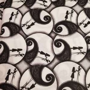 May include: Black and white fabric with a repeating pattern of a spiral design and two figures holding hands. The figures are standing on a hill with a spiral design.