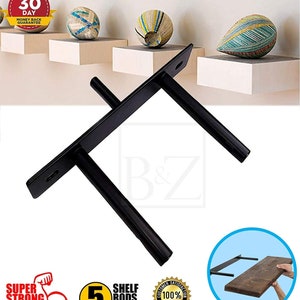 May include: Black metal shelf brackets with a T-shaped design. The brackets are designed to support shelves and are shown with a wooden shelf. The brackets are available in five different sizes. The image also includes a 30-day money back guarantee.