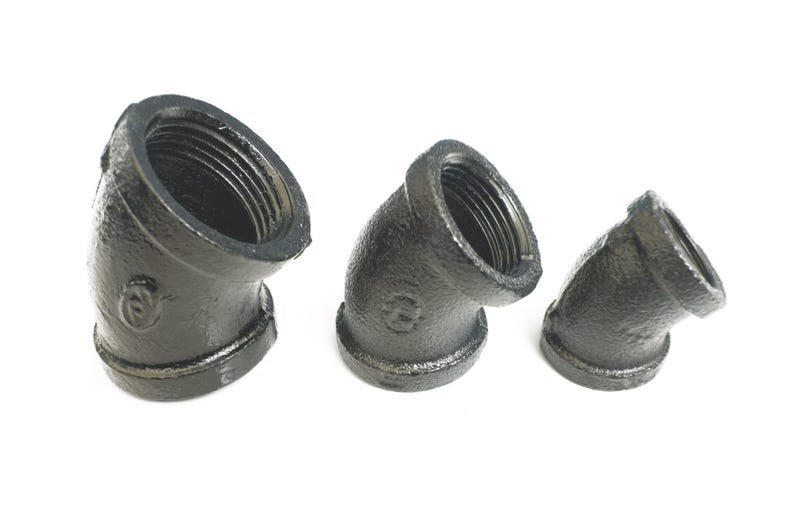 May include: Three black iron pipe fittings, each with a 45-degree angle, are arranged in a row from largest to smallest.