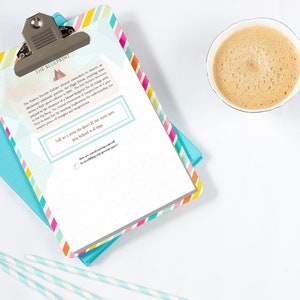 May include: A clipboard with a colorful striped border and a silver clip, resting on a teal notebook. The clipboard has text that reads "THE BLUEPRINT". A cup of coffee and striped straws are also in the image.