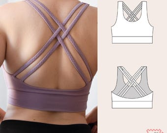 May include: A lavender sports bra with crisscross straps on the back. The bra has a wide band under the bust and a supportive design. A diagram of the bra is shown on the right side of the image, along with the text "DO IT MY WEAR".