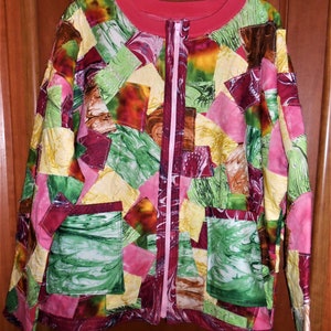 May include: A colorful patchwork jacket with a pink zipper and two pockets. The jacket is made of different fabrics with a marbled pattern in shades of green, pink, yellow, and brown.