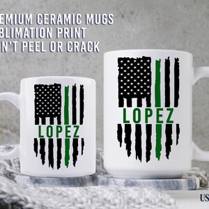 May include: Two white ceramic mugs featuring a black and green distressed American flag graphic with the name LOPEZ printed in green. Text above reads PREMIUM CERAMIC MUGS SUBLIMATION PRINT WON'T PEEL OR CRACK and USA ZONE is at the bottom right.