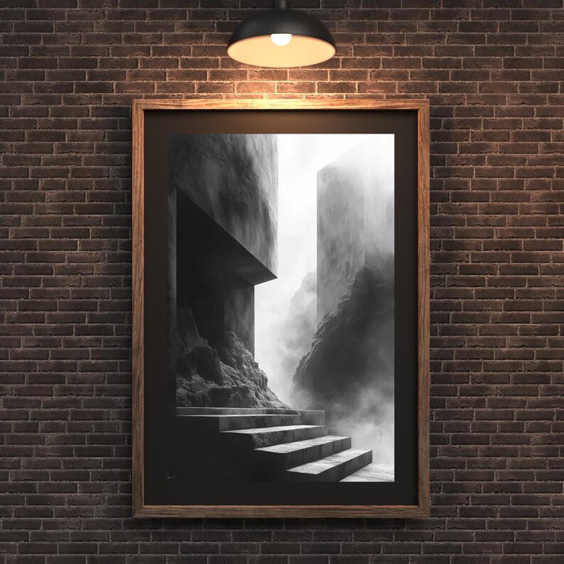 Puede incluir: L&aacute;mina art&iacute;stica enmarcada en blanco y negro que representa una escena arquitect&oacute;nica surrealista. Una escalera conduce a una abertura oscura, con estructuras imponentes y una atm&oacute;sfera brumosa. La impresi&oacute;n est&aacute; en un marco de madera, montada en una pared de ladrillo.