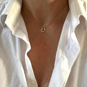 Little vintage gold and diamond heart pendant and chain.Small diamond heart vintage necklace.Little curly heart pendant and 16.5 inch chain.